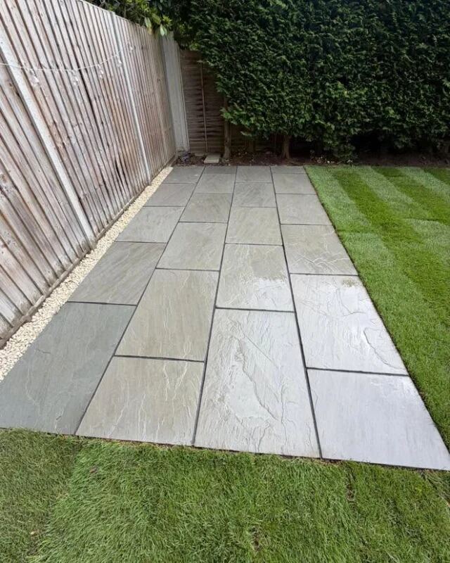 Sandstone pathway alongside a new lawn